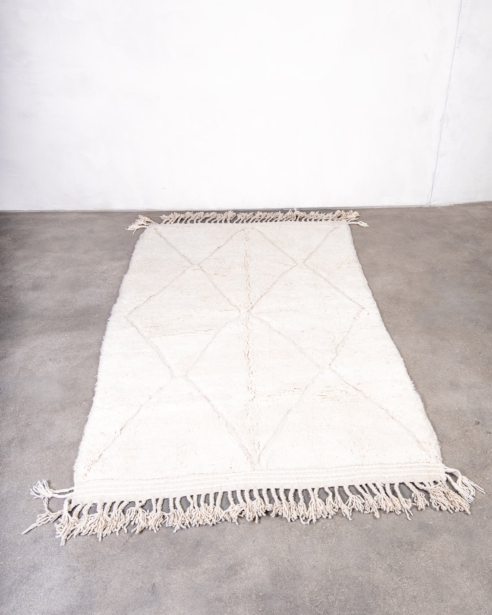 Modern, designer, handcrafted Berber rug from Morocco. Beniourain carpet with beautiful colours and patterns and fluffy wool texture.